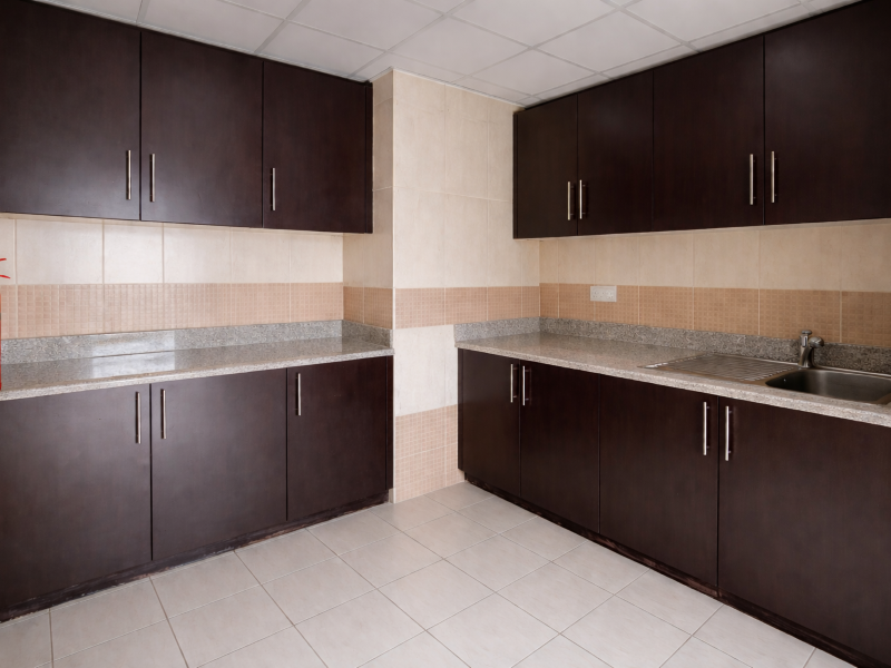 Modern kitchen with dark wood cabinetry