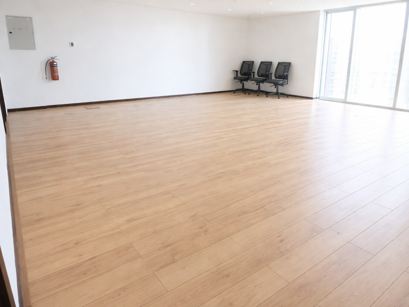 Spacious office with light oak floors